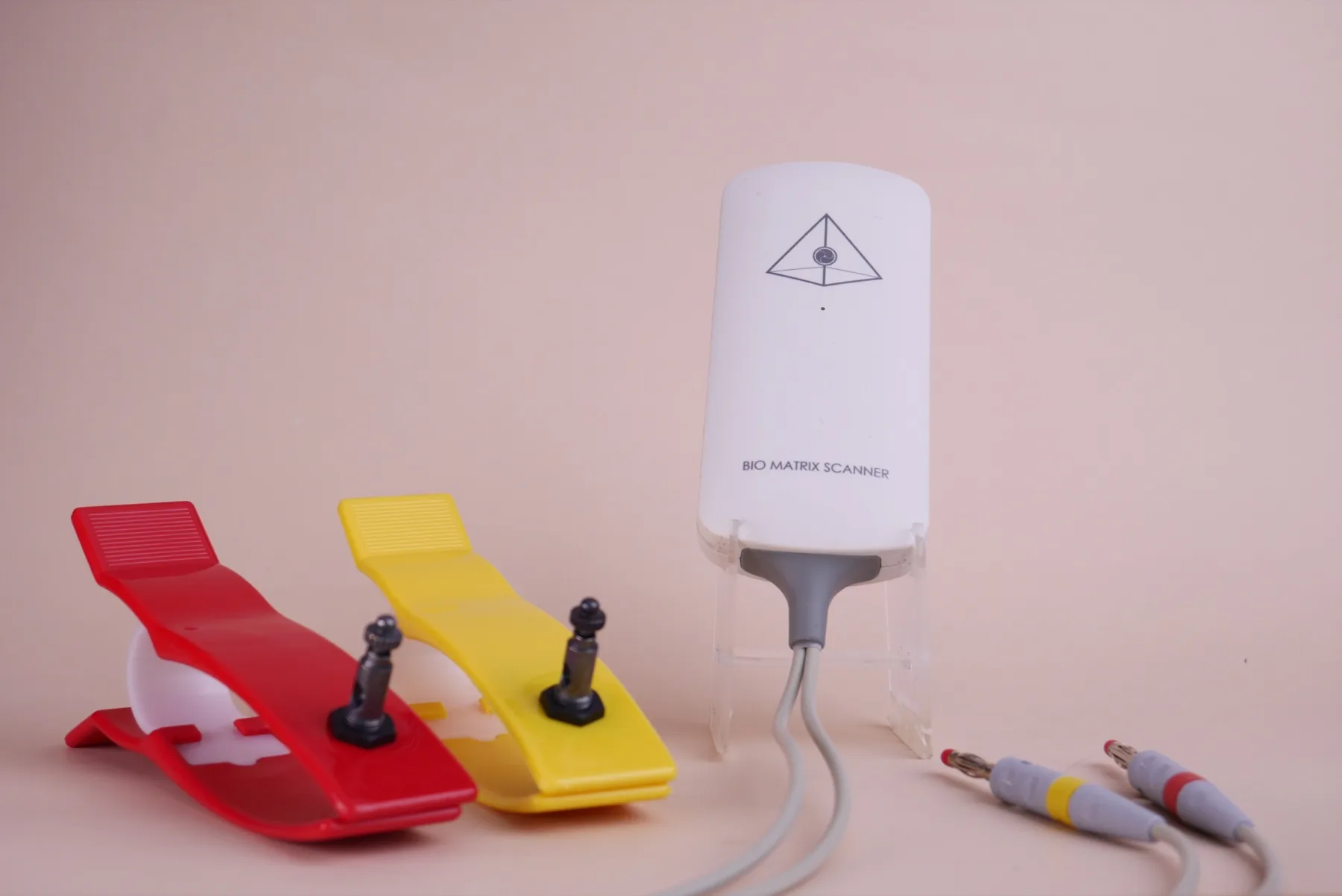 Bio Matrix Scan white interface device with red and yellow electrodes and connecting cables
