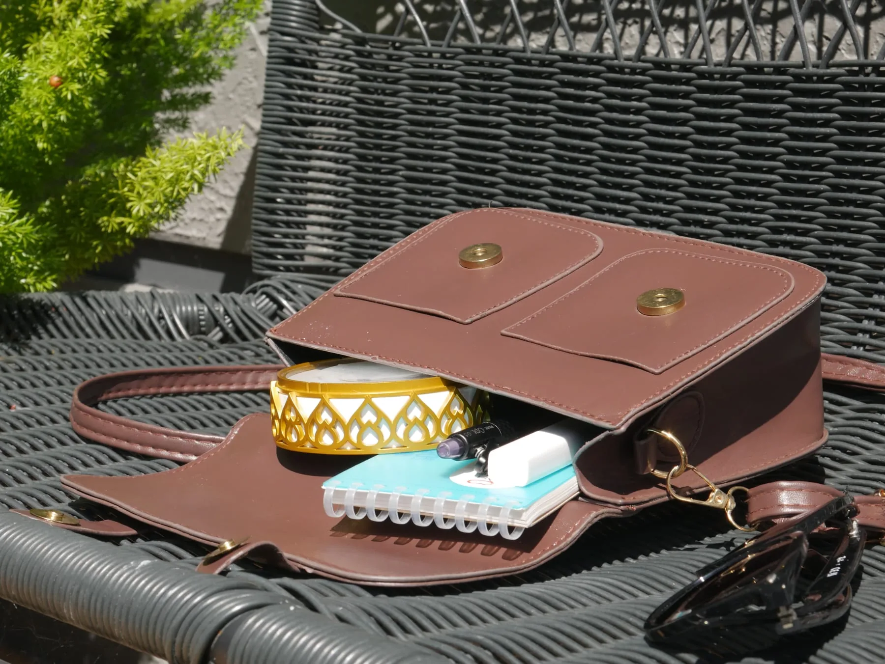 Portable Chakra Activator packed in a small handbag with everyday personal items