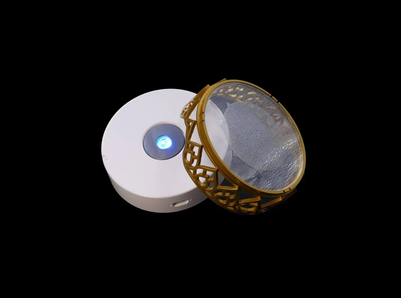 Open Chakra Activator showing its illuminated base and companion Silica Disc