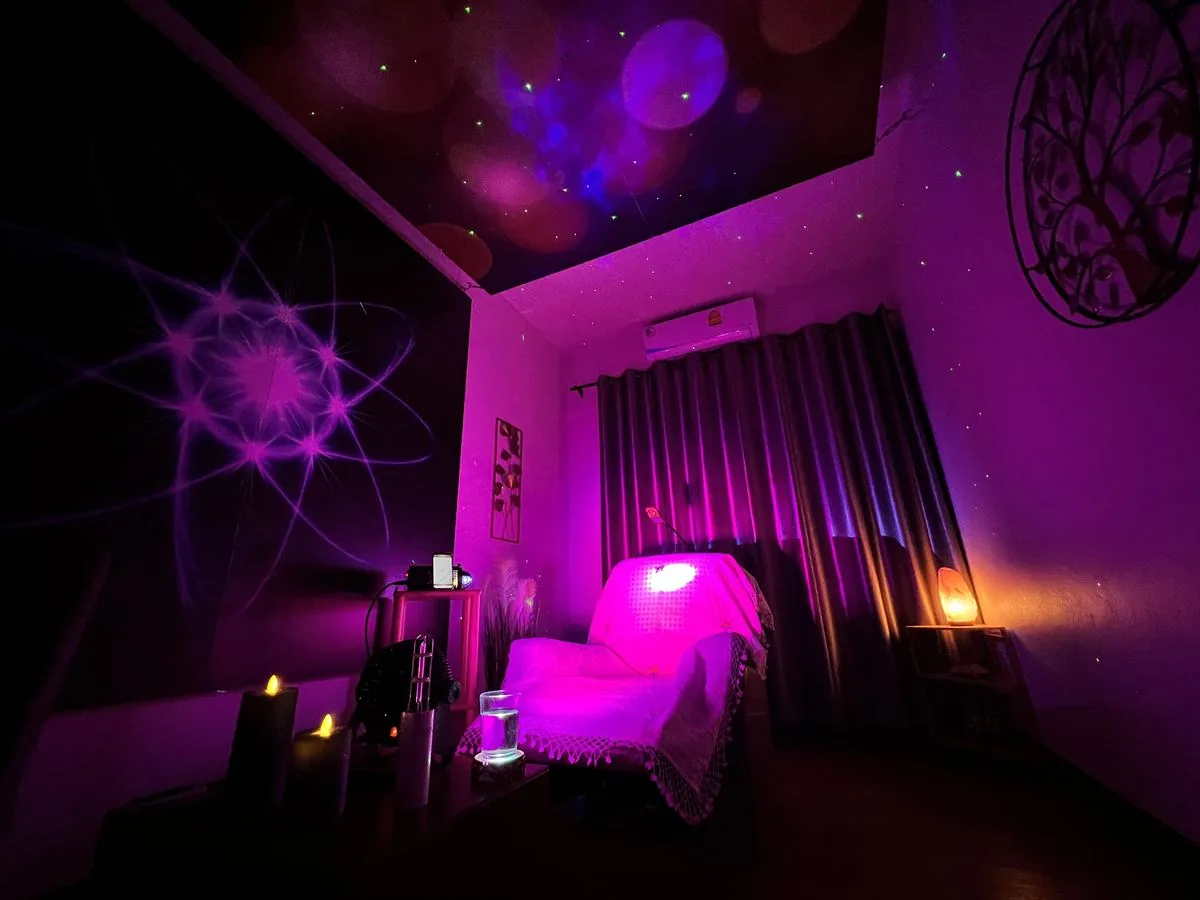 Light Mandalas healing room with warm pink light and wellness technology