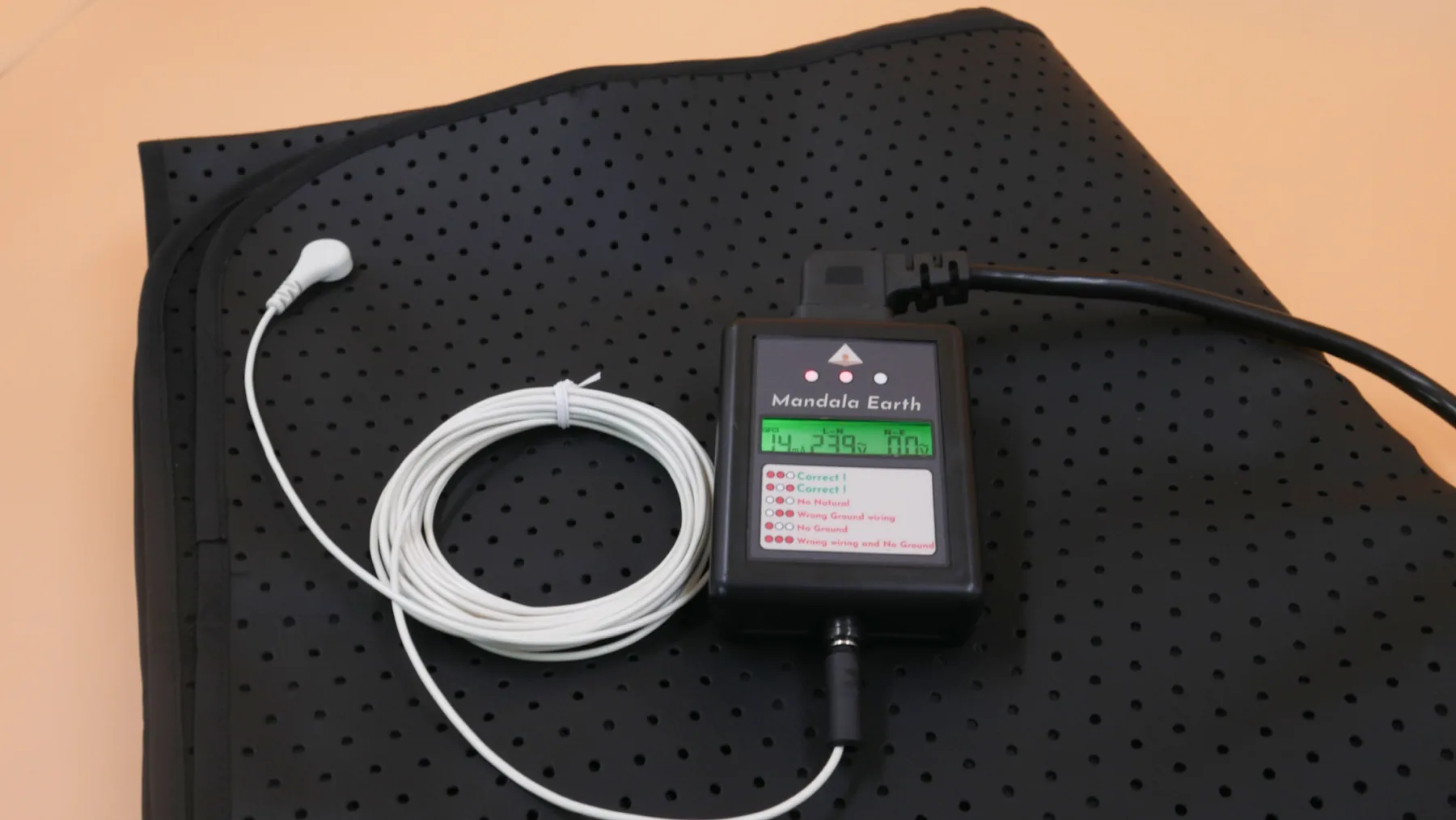 Complete Mandala Earthing set with conductive black mat, Mandala Earth module, and white connection lead