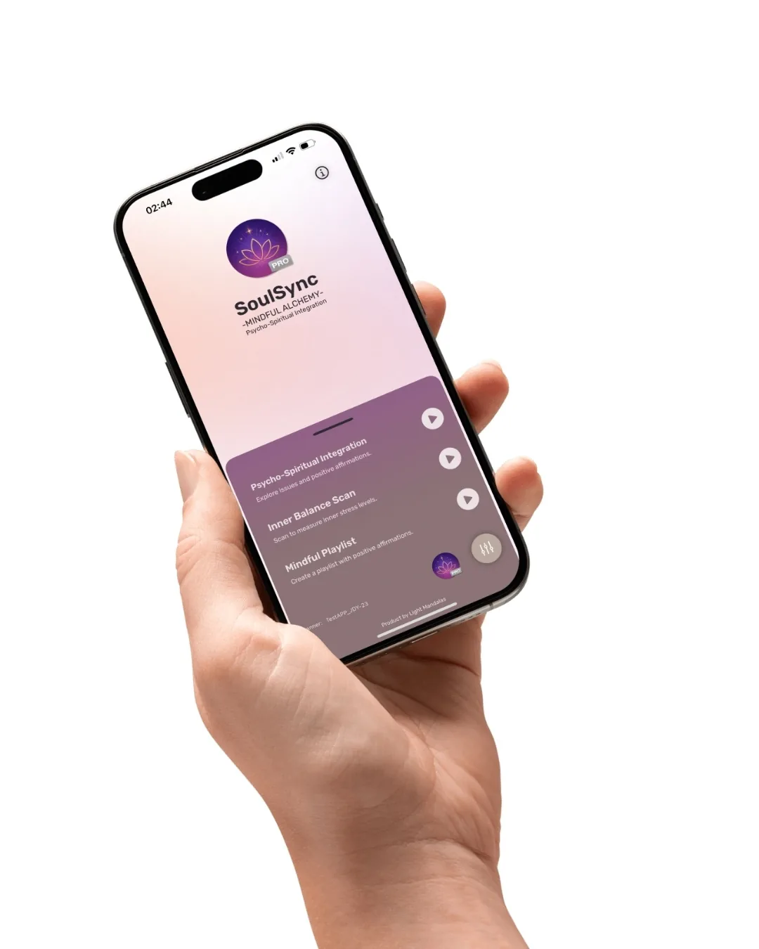 Hand holding the SoulSync app showing psycho-spiritual integration, inner balance scan, and mindful playlist